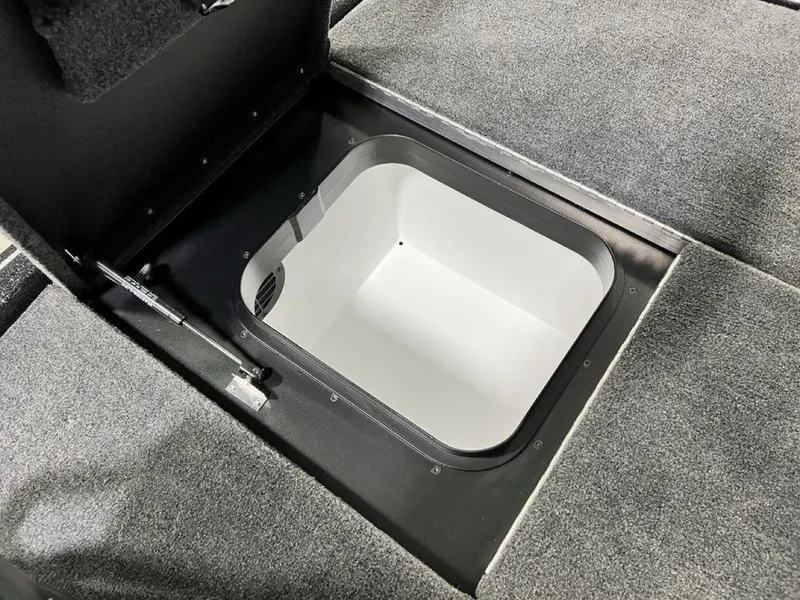 Slide: The Image of 2025 Skeeter FXR20 PRO boat storage compartment with open lid, showcasing interior space. - 4