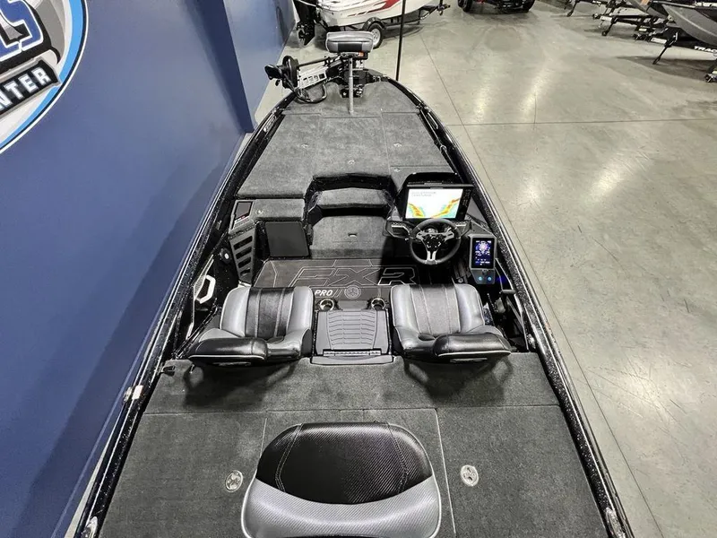 Slide: The Image of 2025 Skeeter FXR20 PRO boat interior with dual seats and advanced navigation system. - 5