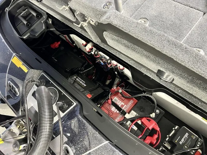 Slide: The Image of 2025 Skeeter FXR20 PRO boat battery compartment with wiring and components. - 8