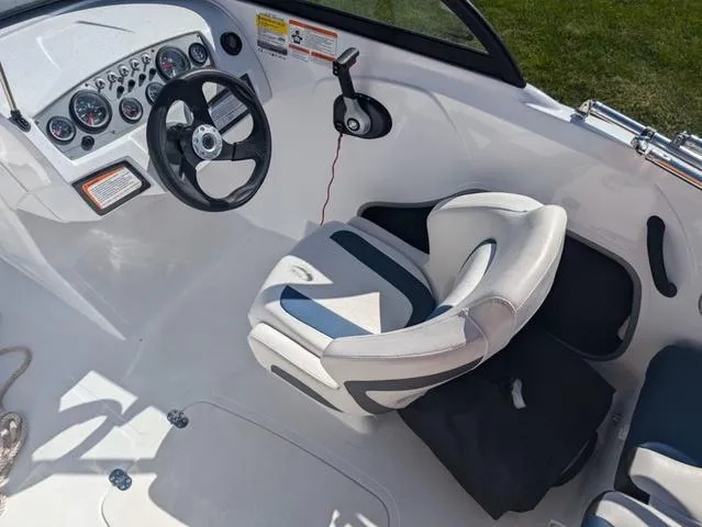 Slide: The Image of 2021 Tracker 450 TF boat interior with steering wheel and seat. - 10