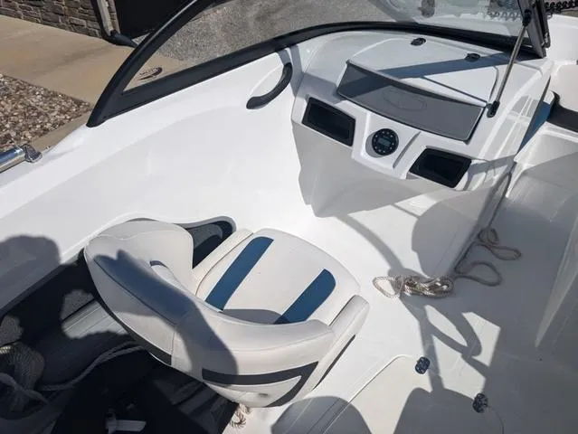 Slide: The Image of 2021 Tracker 450 TF boat interior with white seating and dashboard. - 12