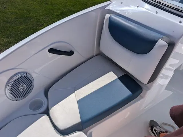Slide: The Image of 2021 Tracker 450 TF boat interior with blue and white seating. - 14