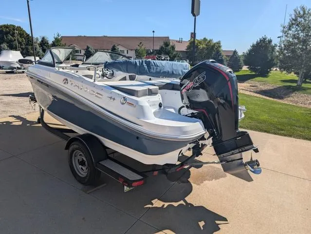 Slide: The Image of 2021 Tracker 450 TF boat on trailer, parked outdoors in sunny setting. - 3