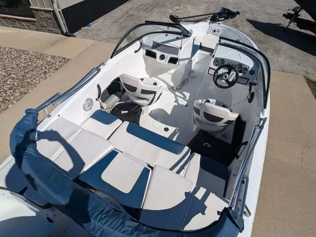 Slide: The Image of 2021 Tracker 450 TF boat interior with seating and steering wheel. - 5