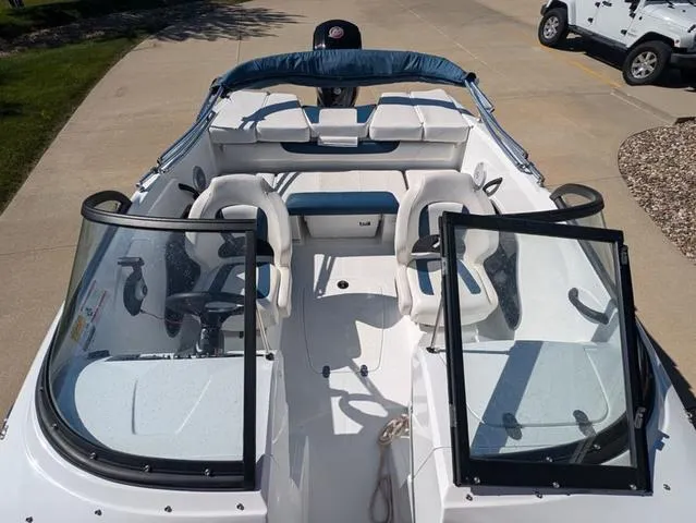 Slide: The Image of 2021 Tracker 450 TF boat interior with seating and steering wheel. - 7