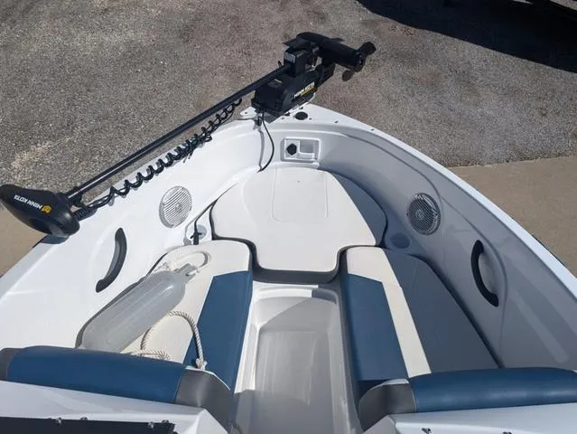 Slide: The Image of 2021 Tracker 450 TF boat interior with seating and trolling motor. - 8