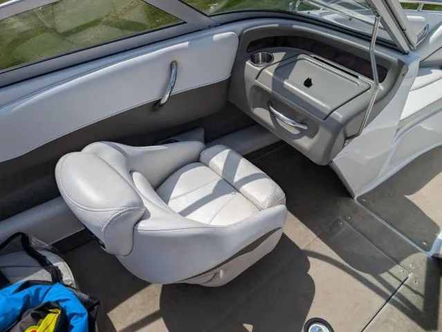 Slide: The Image of Interior of a 2007 Crownline 190 SS boat with gray seating and dashboard. - 12
