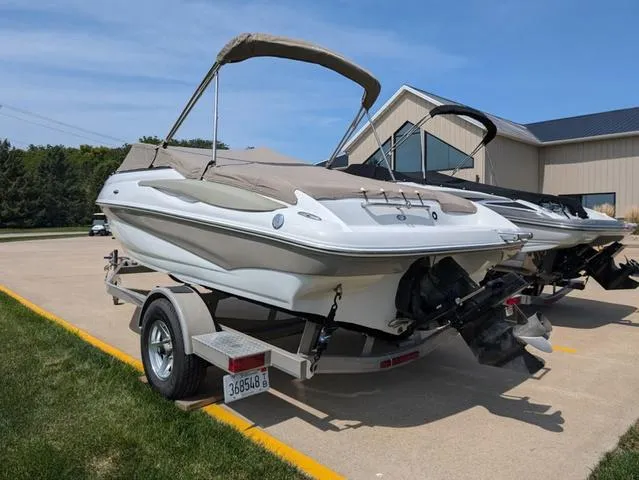 Slide: The Image of 2007 Crownline 190 SS boat on trailer, parked outdoors. - 17