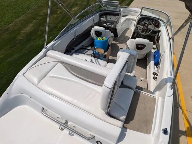 Slide: The Image of 2007 Crownline 190 SS boat interior with white seating and steering console. - 7