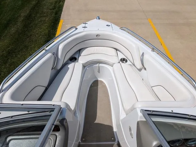 Slide: The Image of 2007 Crownline 190 SS boat interior with white seating and open bow design. - 9