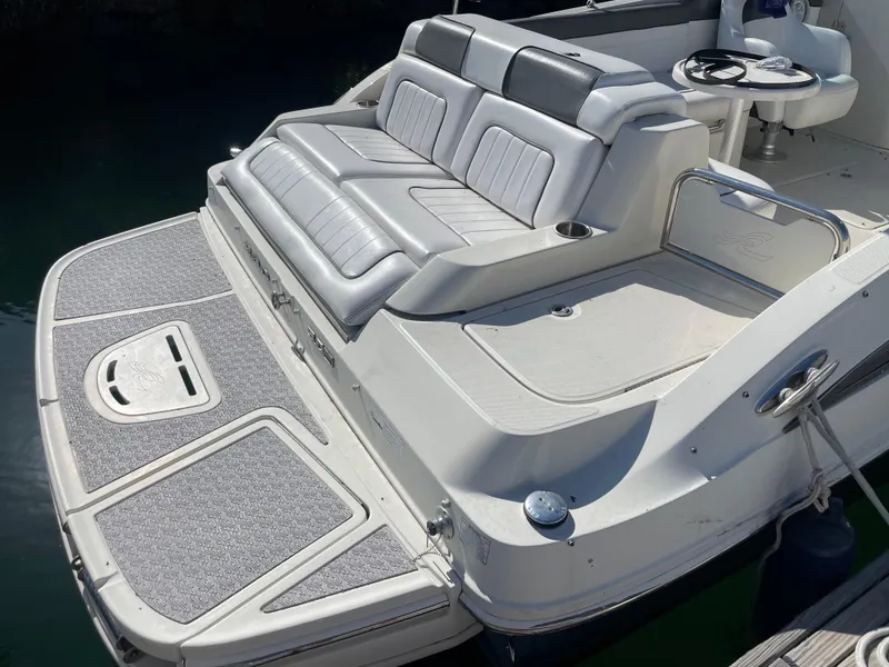 Slide: The Image of 2010 Sea Ray 260 Sundeck boat with spacious seating and swim platform. - 5