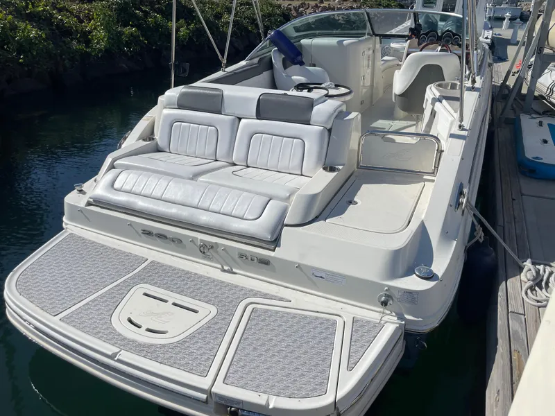 Slide: The Image of 2010 Sea Ray 260 Sundeck boat with spacious seating and swim platform. - 6