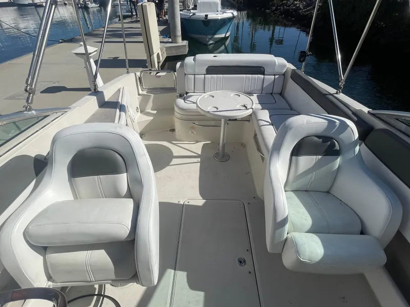 Slide: The Image of 2010 Sea Ray 260 Sundeck boat interior with seating and table. - 8