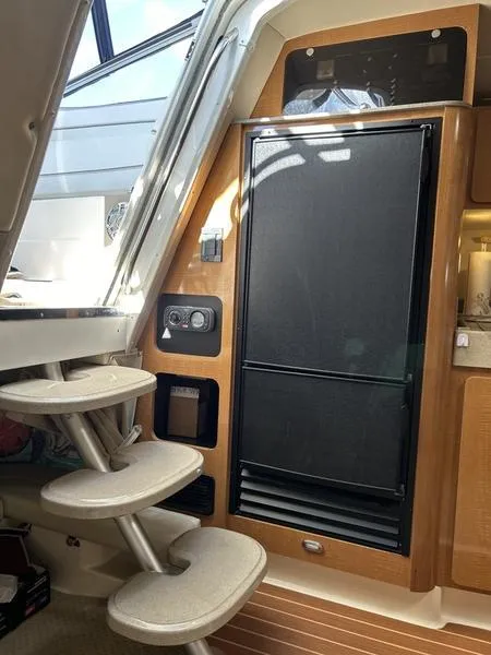 Slide: The Image of Interior of 2010 Larson Cabrio 370 yacht with steps and refrigerator. - 20