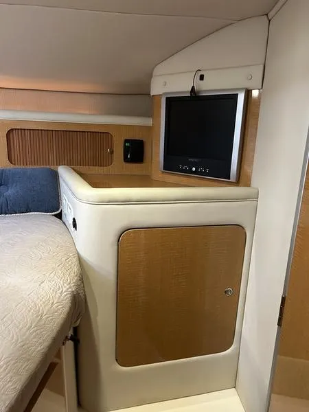 Slide: The Image of Interior of 2010 Larson Cabrio 370 with TV and storage cabinet. - 22