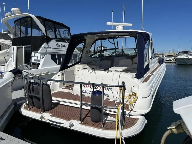 Slide: The Image of 2010 Larson Cabrio 370 boat docked in marina, rear view. - 30