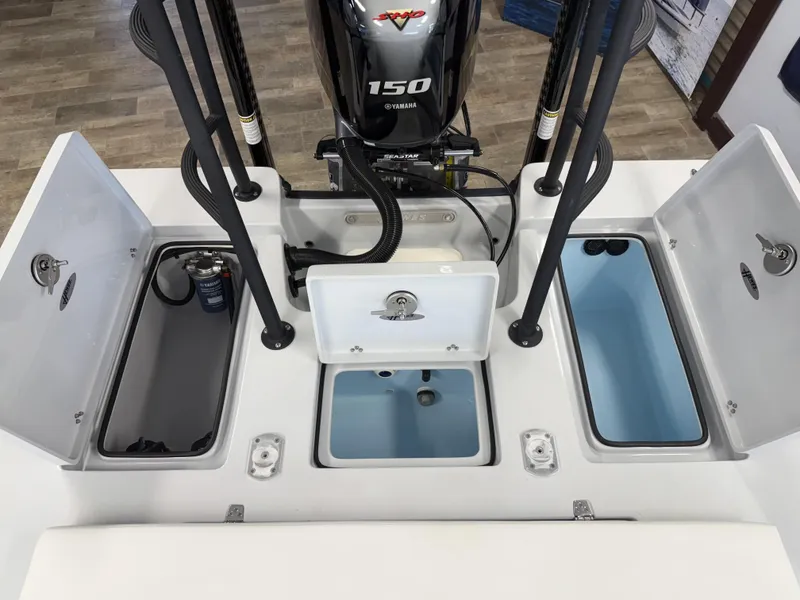 Slide: The Image of 2025 Hewes 18 Redfisher boat interior with Yamaha 150 engine and storage compartments. - 12