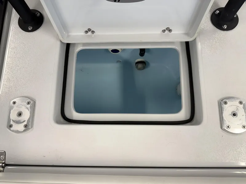 Slide: The Image of Open storage compartment on 2025 Hewes 18 Redfisher boat. - 14
