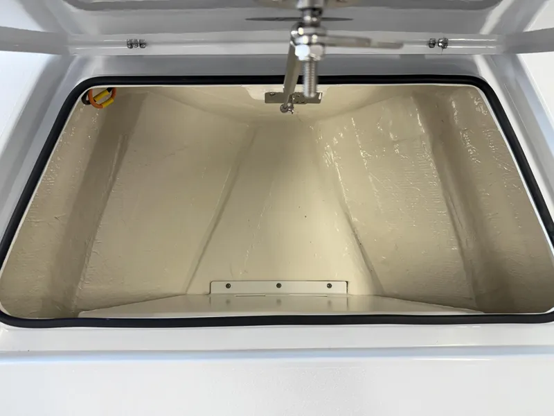 Slide: The Image of Open storage compartment of 2025 Hewes 18 Redfisher boat, showcasing interior space. - 29