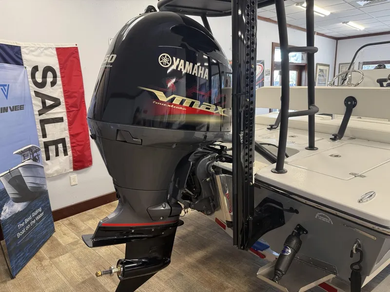Slide: The Image of 2025 Hewes 18 Redfisher with Yamaha VMAX outboard engine on display for sale. - 4