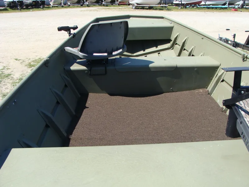 Slide: The Image of 2023 Crestliner 1648 Jon boat interior with seating and carpeted floor. - 3