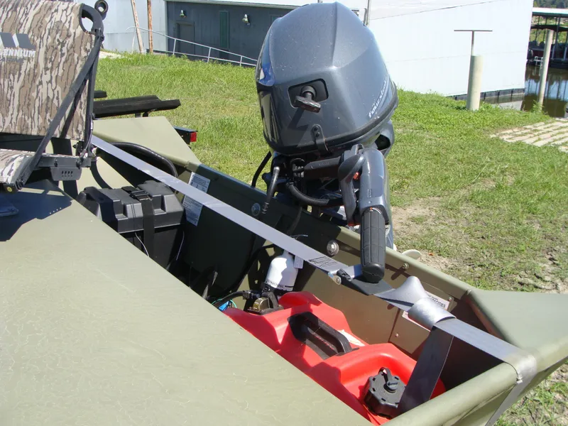 Slide: The Image of 2023 Crestliner 1648 Jon boat with outboard motor and camo seat. - 6