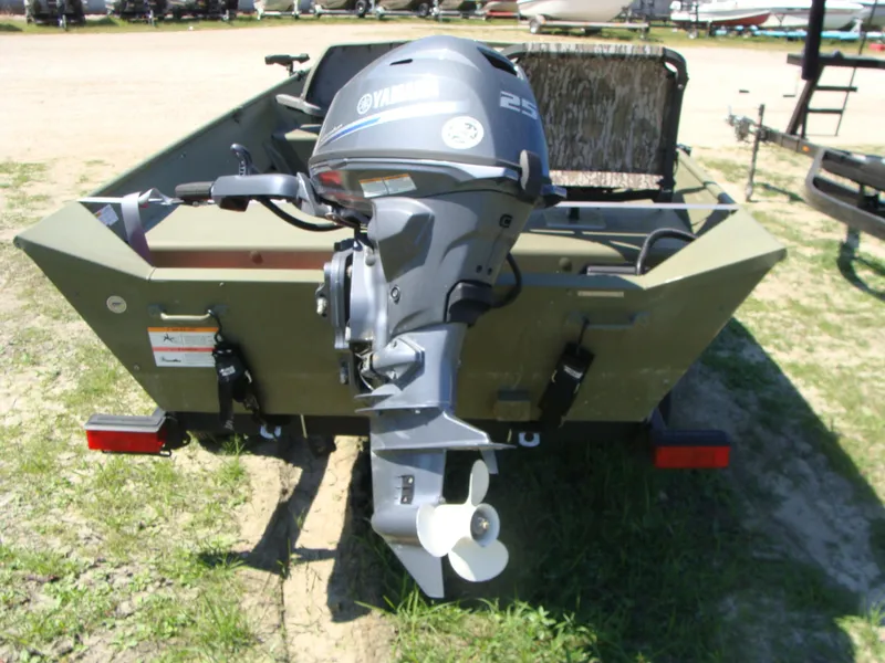 Slide: The Image of 2023 Crestliner 1648 Jon boat with Yamaha 25HP outboard motor, parked on grass. - 7