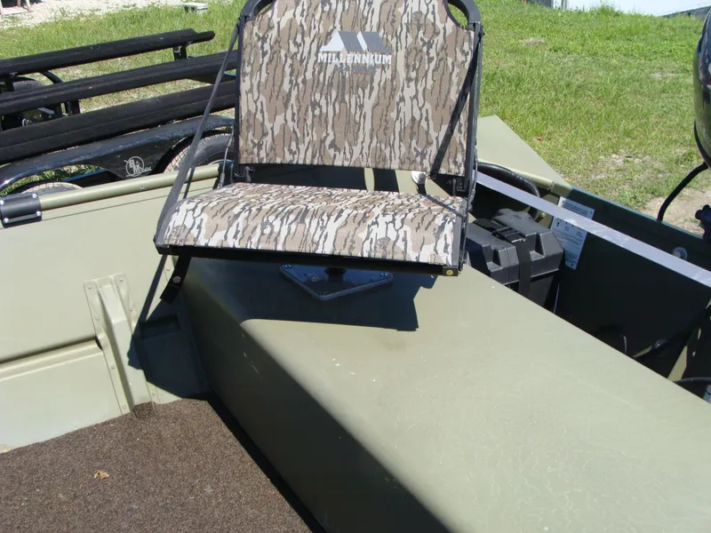 Slide: The Image of 2023 Crestliner 1648 Jon boat with camo-patterned seat on deck. - 8