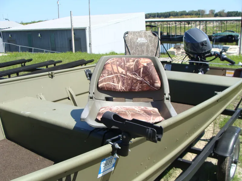 Slide: The Image of 2023 Crestliner 1648 Jon boat with camouflage seats and outboard motor. - 9