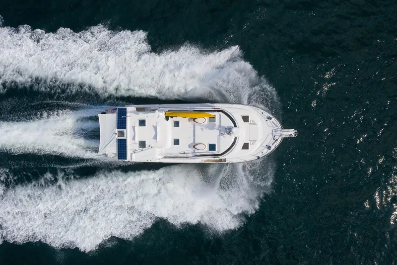 The Image of Aerial view of 2025 Ranger Tugs R-43 S yacht cruising on open water. - 0