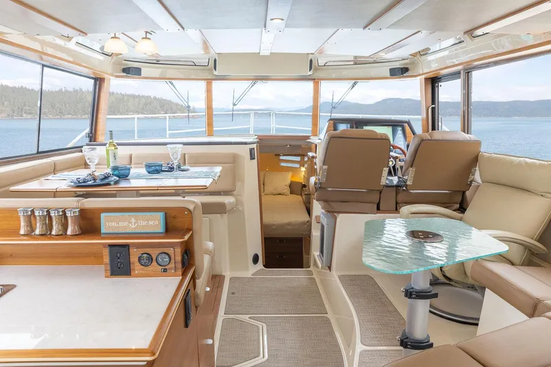 Slide: The Image of Luxurious interior of 2025 Ranger Tugs R-43 S yacht with scenic ocean view. - 7