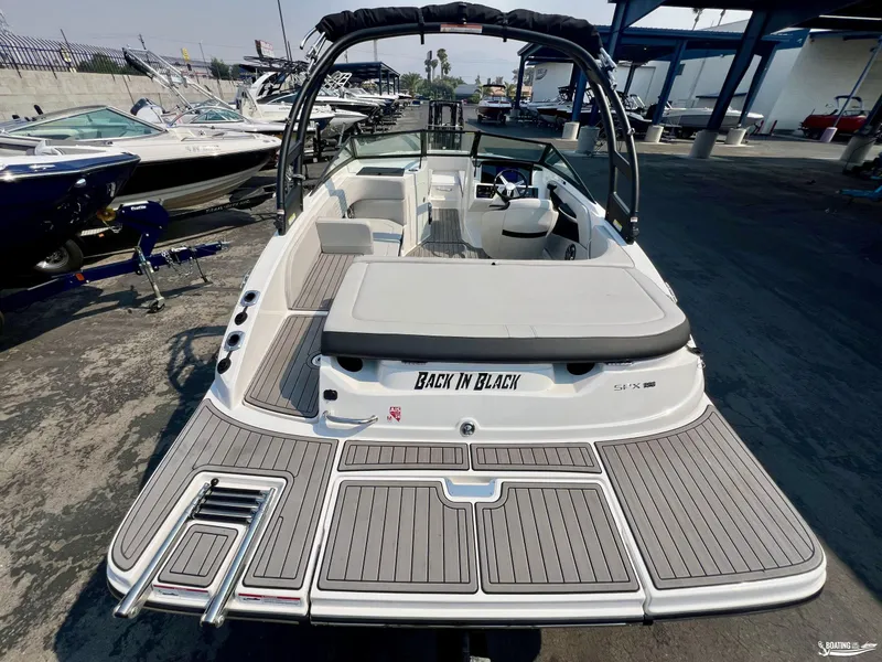 Slide: The Image of 2022 Sea Ray 190 Sport boat with sleek design and spacious deck. - 2