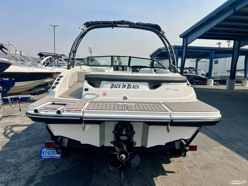 Slide: The Image of 2022 Sea Ray 190 Sport boat, rear view, parked in marina. - 3