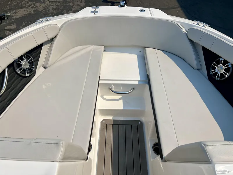 Slide: The Image of 2022 Sea Ray 190 Sport boat interior with white seating and sleek design. - 4