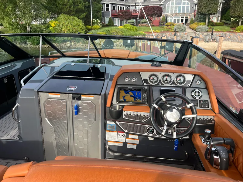 Slide: The Image of 2016 Cruisers Yachts 338 SOUTH BEACH helm with modern controls and navigation system. - 10