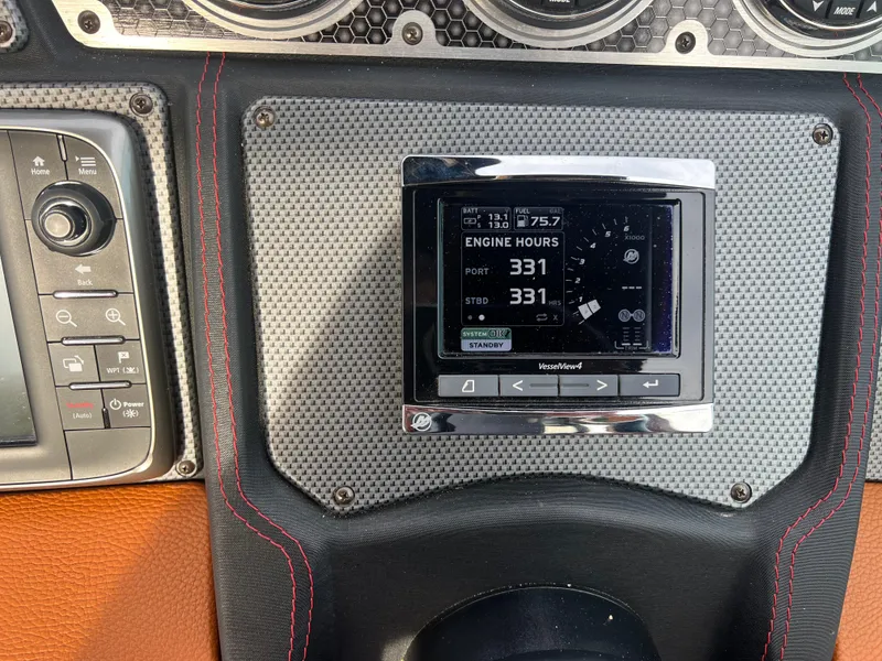 Slide: The Image of Dashboard of 2016 Cruisers Yachts 338 SOUTH BEACH showing engine hours and controls. - 14