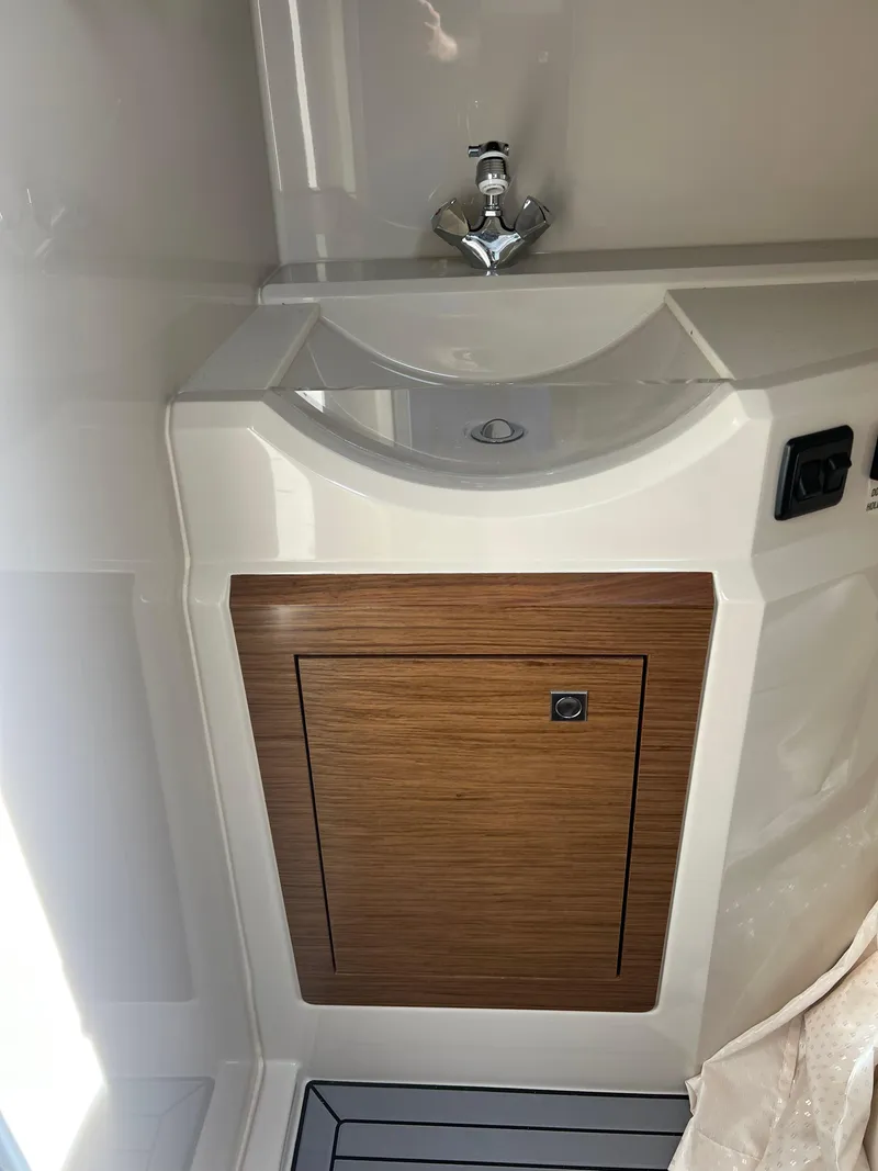 Slide: The Image of 2016 Cruisers Yachts 338 SOUTH BEACH bathroom sink with wooden cabinet. - 17