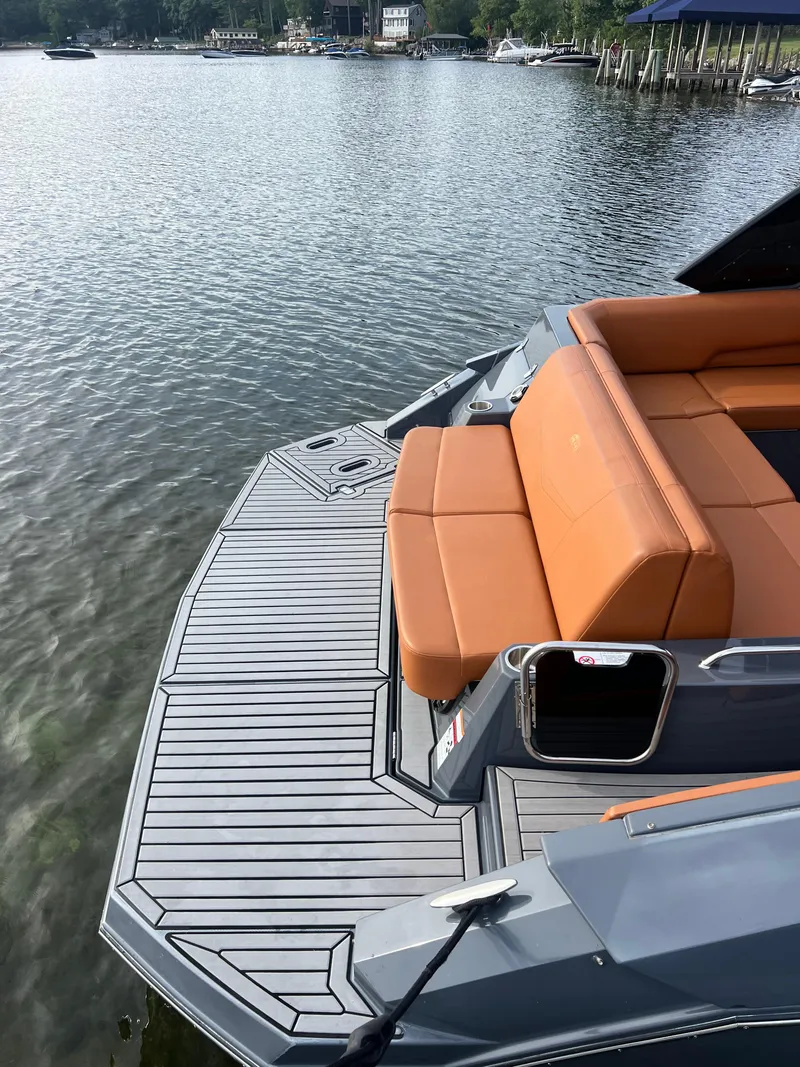 Slide: The Image of 2016 Cruisers Yachts 338 SOUTH BEACH with tan seating on a calm lake. - 7