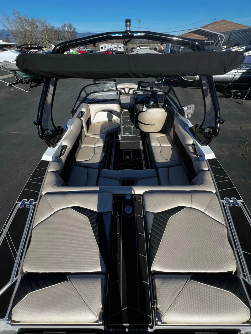 Slide: The Image of 2024 Centurion Fi23 boat interior with luxurious seating and sleek design. - 12