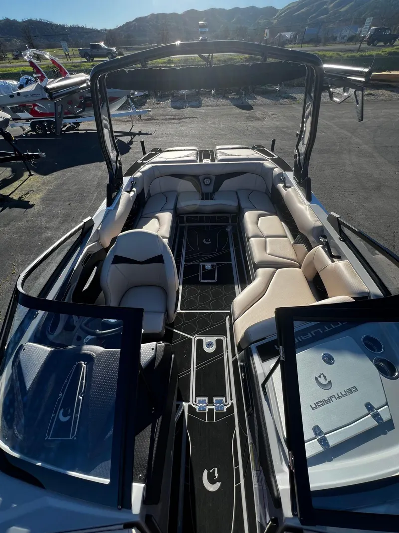 Slide: The Image of 2024 Centurion Fi23 boat interior with luxurious seating and sleek design. - 13