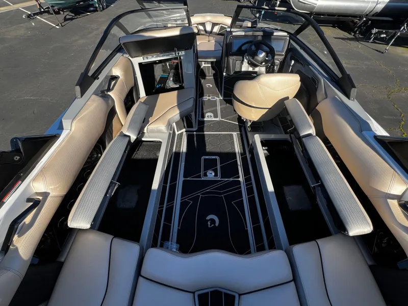 Slide: The Image of 2024 Centurion Fi23 boat interior with luxurious seating and modern dashboard design. - 15