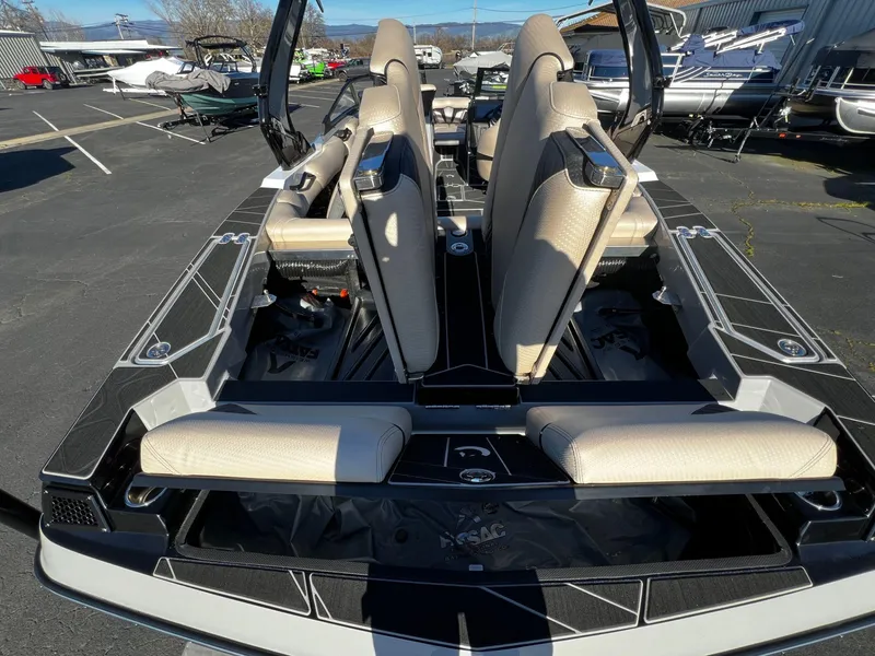 Slide: The Image of 2024 Centurion Fi23 boat interior with beige seating and sleek design. - 16