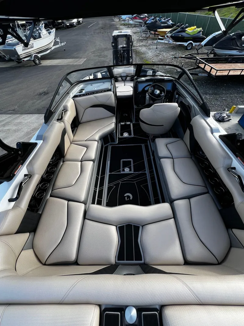 Slide: The Image of 2024 Centurion Fi23 boat interior with spacious seating and modern design. - 6