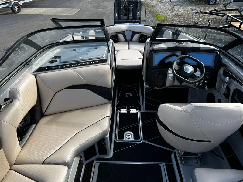 Slide: The Image of 2024 Centurion Fi23 boat interior with modern dashboard and comfortable seating. - 9