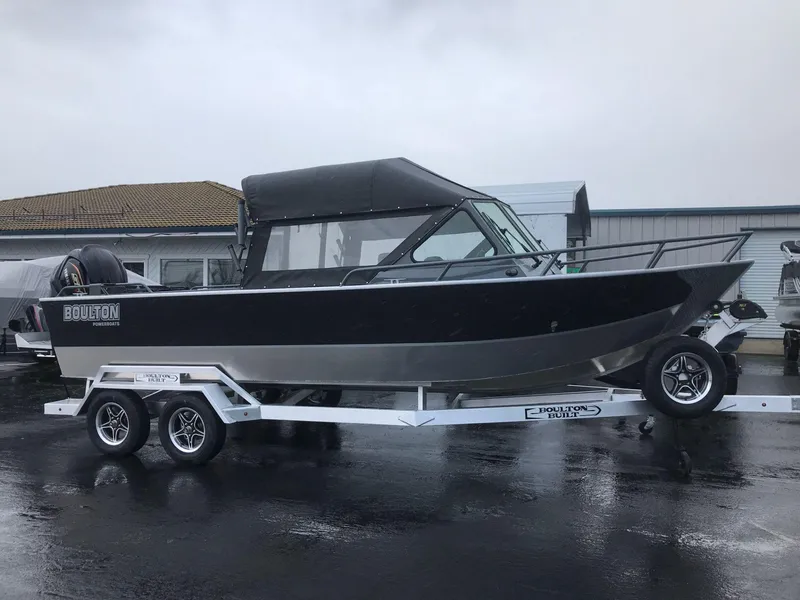 Slide: The Image of 2024 Boulton Powerboats Sentinel Pro 22 on trailer, sleek design, parked outdoors. - 10