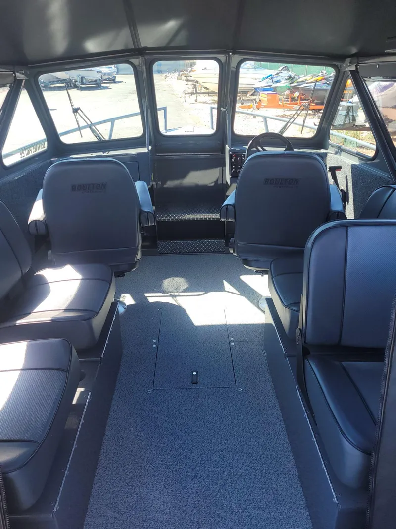 Slide: The Image of Interior of 2024 Boulton Powerboats Sentinel Pro 22, featuring spacious seating and modern design. - 11