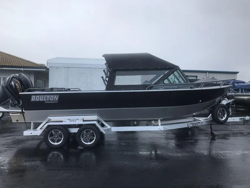 Slide: The Image of 2024 Boulton Powerboats Sentinel Pro 22 on trailer, sleek black design, parked outdoors. - 5