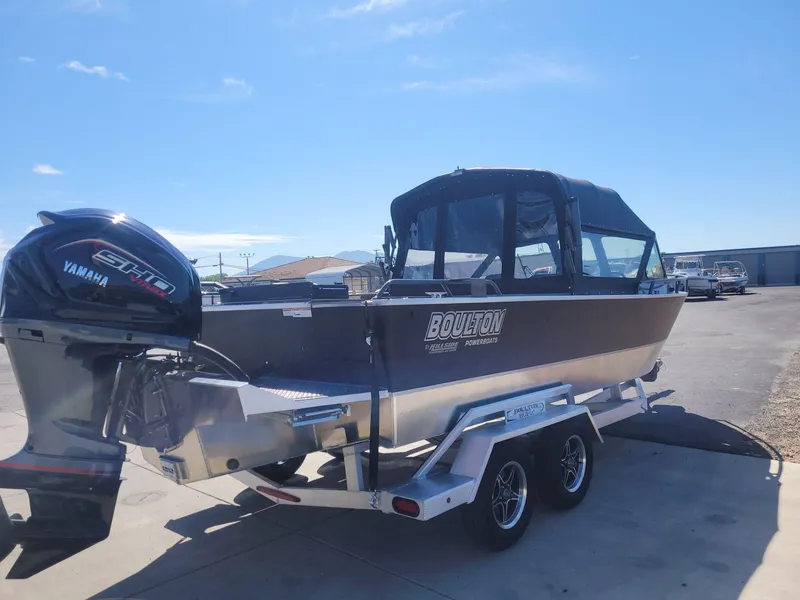 Slide: The Image of 2024 Boulton Sentinel Pro 22 powerboat on trailer with Yamaha engine, parked outdoors. - 6