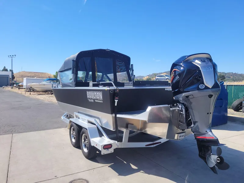 Slide: The Image of 2024 Boulton Powerboats Sentinel Pro 22 on trailer, featuring sleek design and powerful outboard motor. - 7