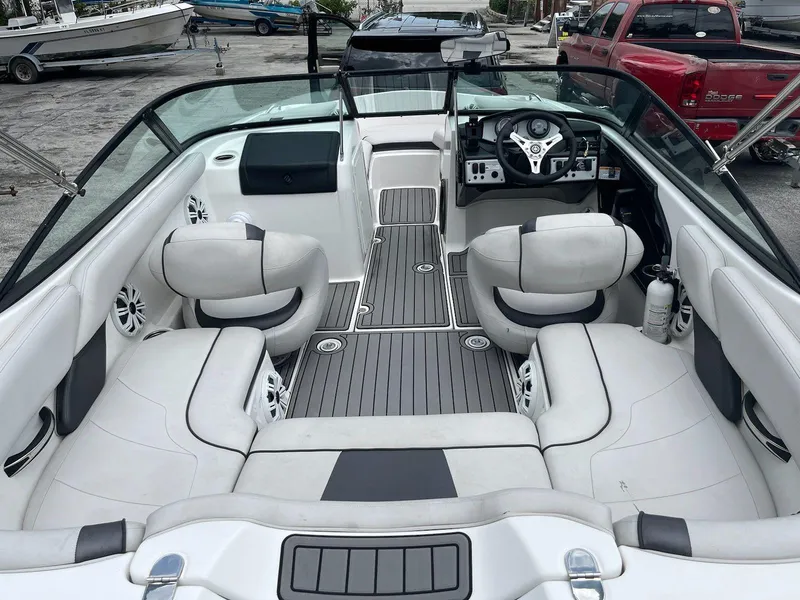 Slide: The Image of 2014 Yamaha Boats SX192 interior with sleek seating and modern dashboard. - 2